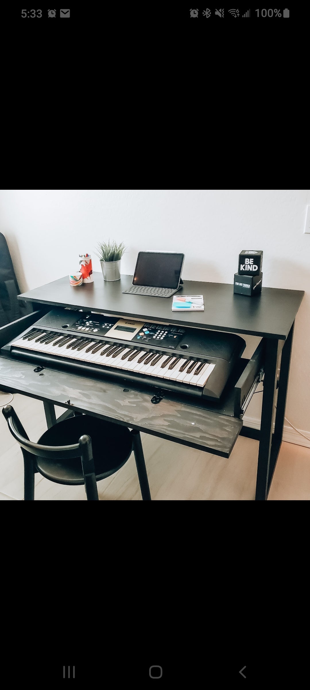 Desk with slide out piano tray